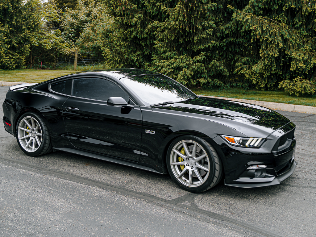 Front end of Mustang GT S550 with silver wheels and yellow Brembo brakes