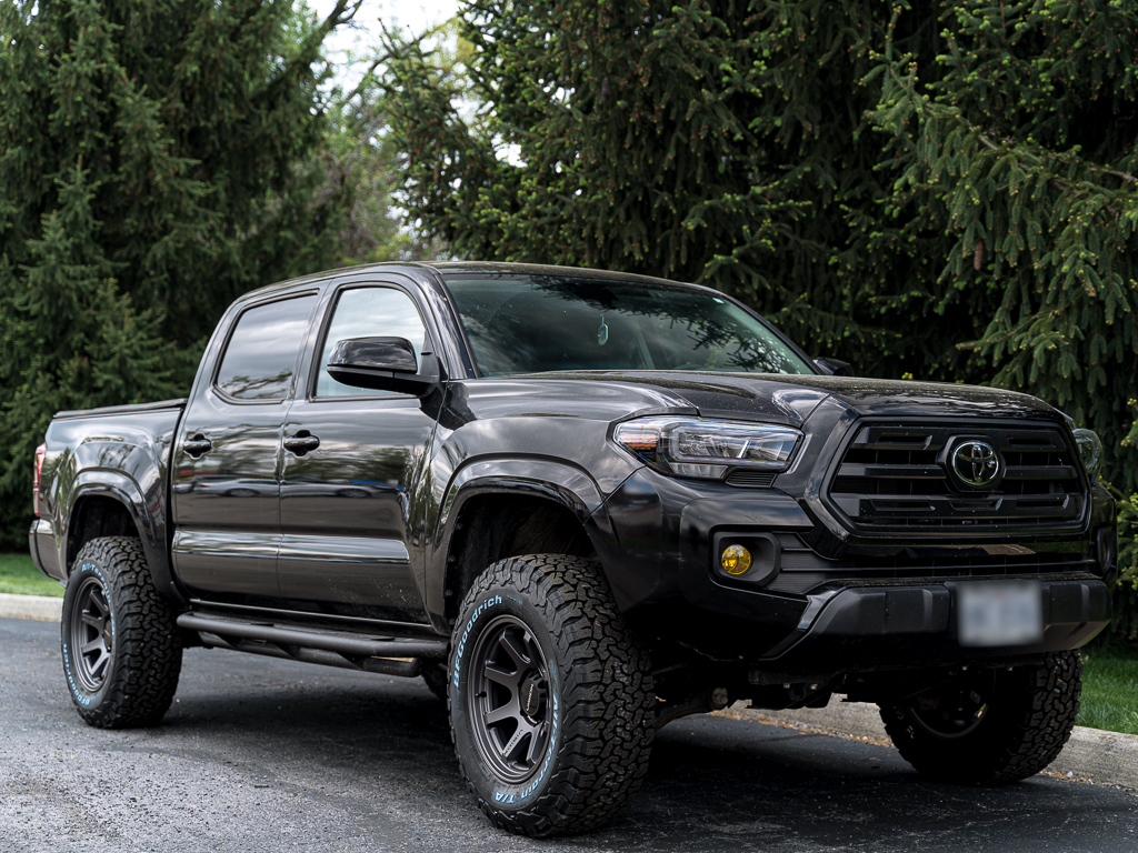 Toyota Tacoma with Vision 351 Flow wheels wrapped in some BFGoodrich All-Terrains and a Wescott Designs lift kit