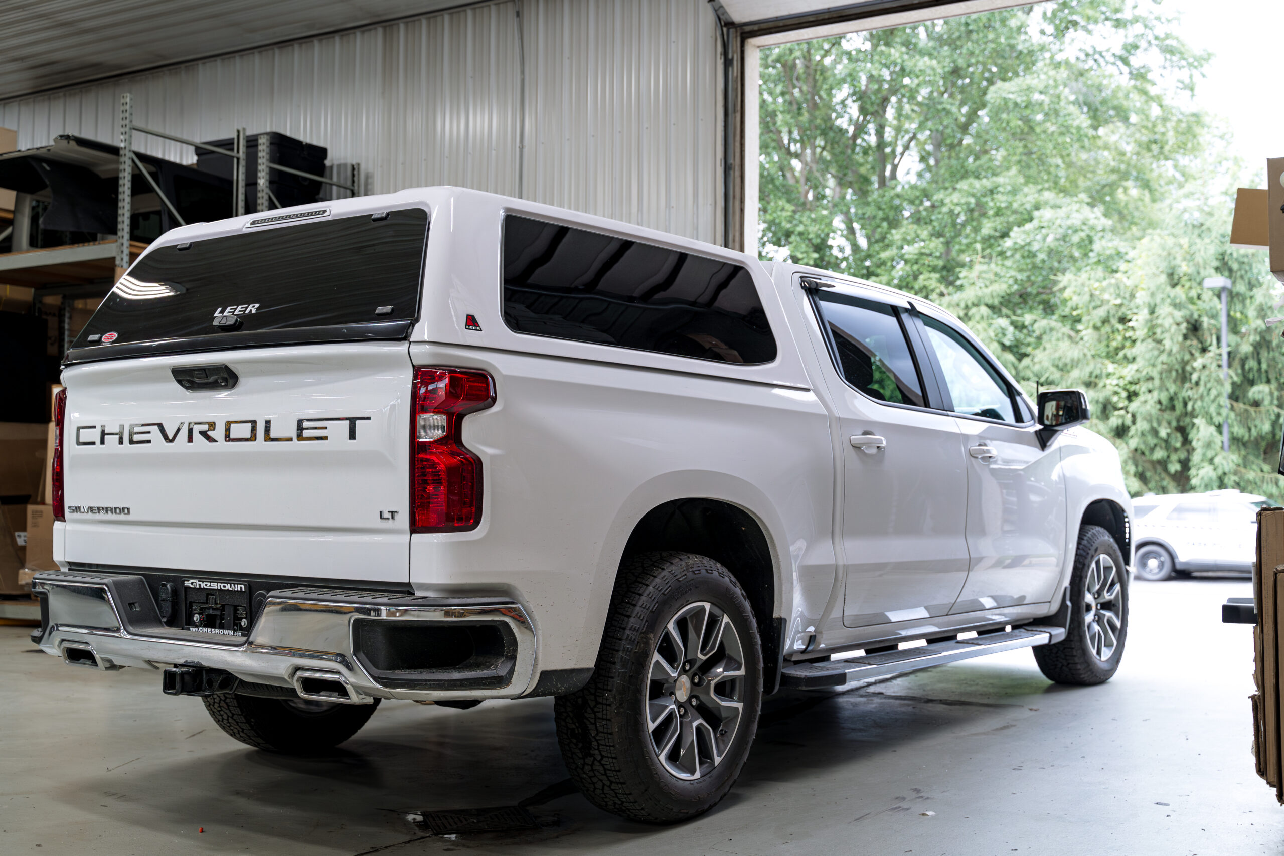 White Silverado with Leer bed cap