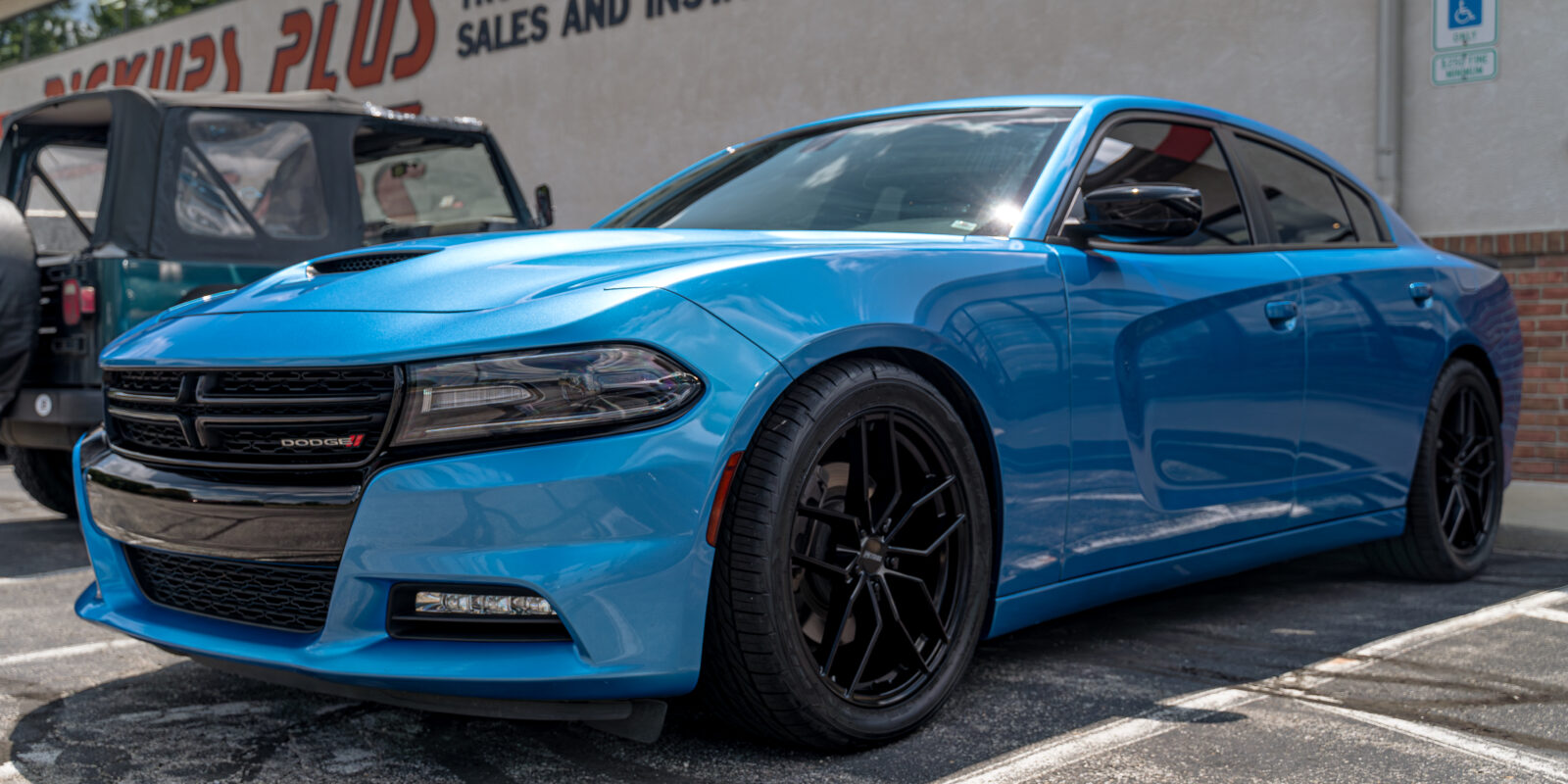 Blue Dodge charger with wheels, tires, tint, and exhaust tips