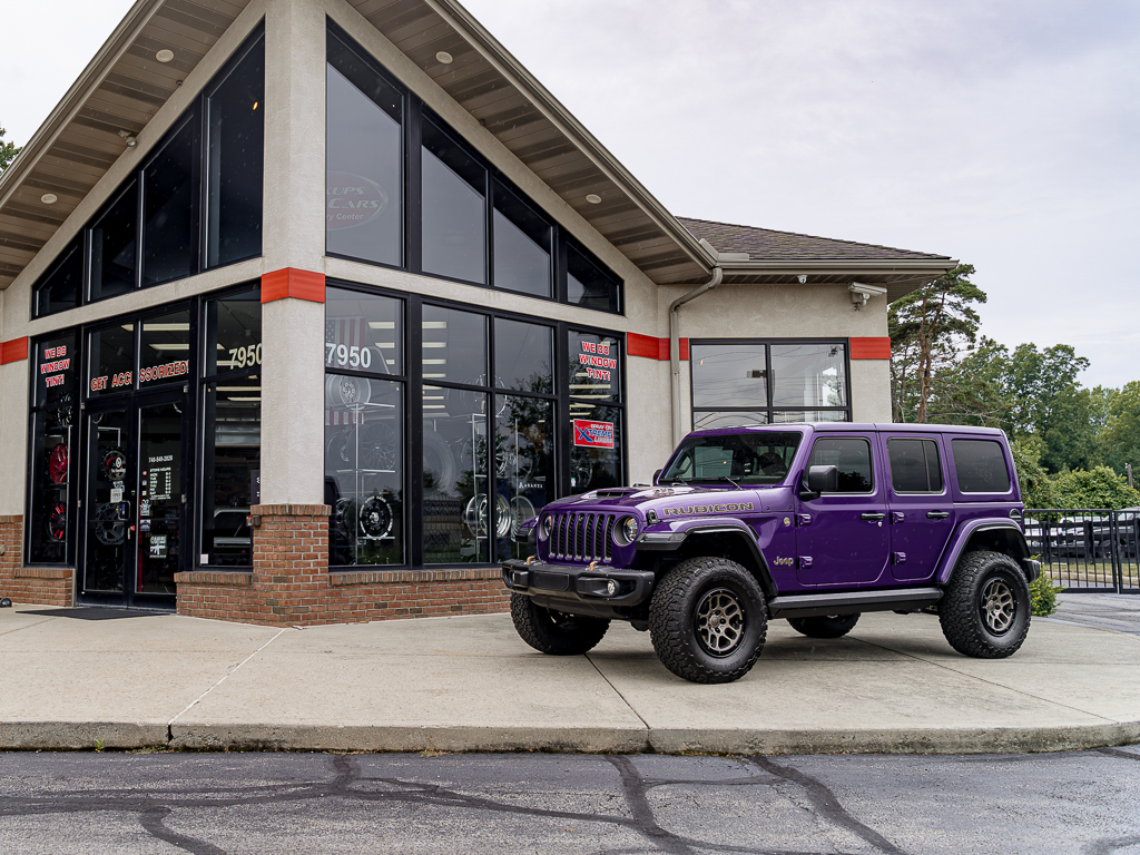 Purple Jeep 392 with black Oracle tail lights, amp running boards, LED side marker lights, Borla exhaust